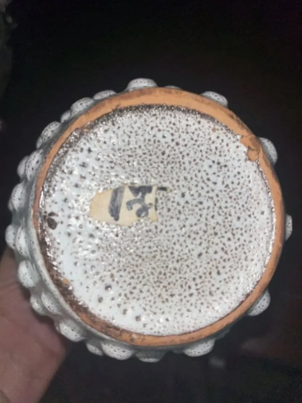 Ceramic vase with white speckled teardrop-shaped patterns